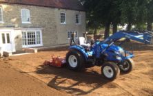 Compact tractor and RotaDairon RD 130 preparing stony soil for grass seeding at Bishop Norton